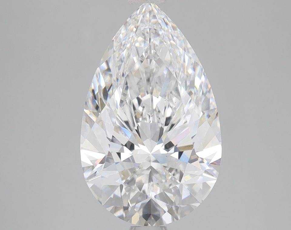 Pear-shaped colorless lab-grown diamond with faceted surface reflecting light, displayed against gray background.
