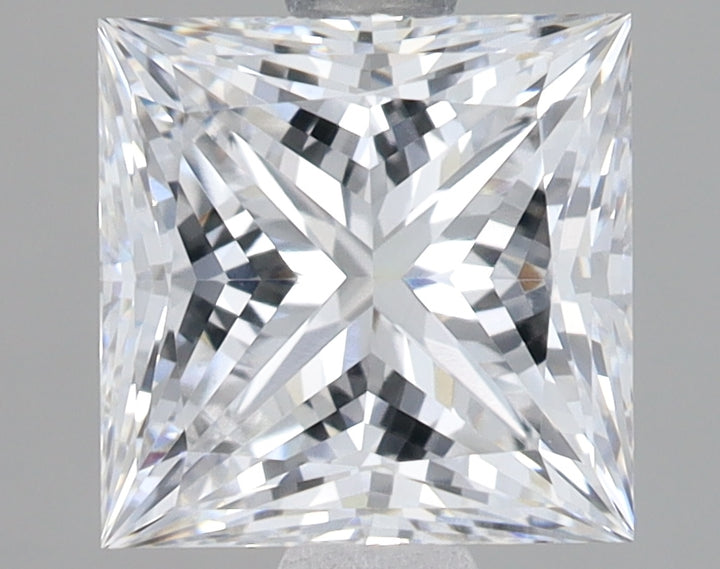 Princess cut lab grown diamond with faceted surface reflecting light, displayed against gray background.
