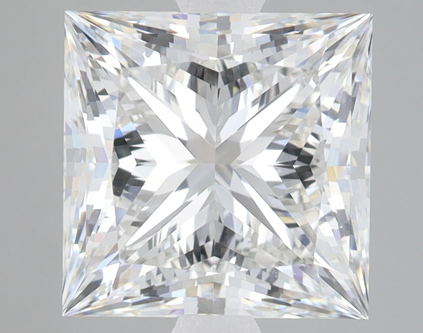 Princess cut lab grown diamond with faceted surface reflecting light, displayed against neutral background.