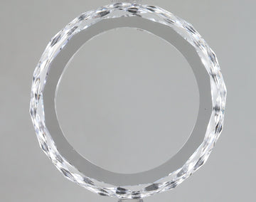 Clear, faceted lab-grown diamond loose stone with brilliant sparkle and reflective surfaces against neutral background.