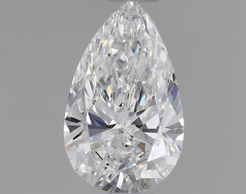 Pear-shaped lab-grown diamond with faceted surface and clear transparency against gray background.
