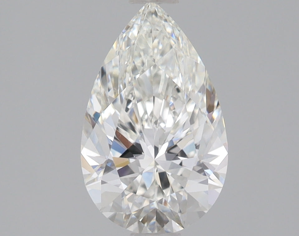 Pear-shaped colorless lab-grown diamond with faceted surface and light reflections on neutral background.