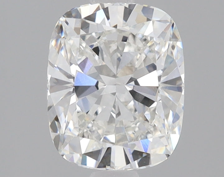 Cushion-cut lab-grown diamond with faceted surface displaying light refraction and internal reflections against gray backgrou