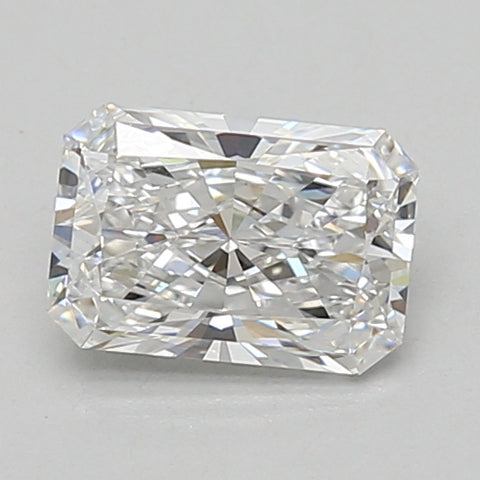 Radiant cut lab-grown diamond with faceted surfaces and light reflections on neutral background.