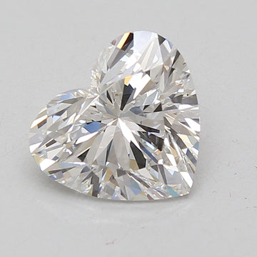 Heart-shaped colorless lab grown diamond with faceted surfaces and light reflections on neutral background.
