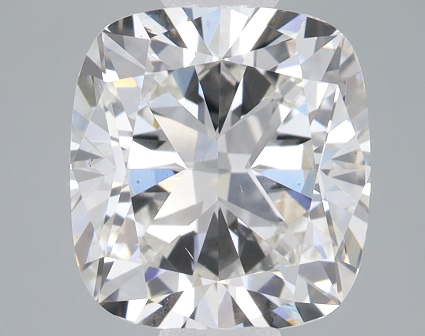 Cushion-cut lab-grown diamond with brilliant faceting and light refraction on gray background.