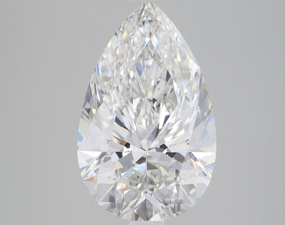 Pear-shaped colorless lab-grown diamond with faceted surface displaying light refraction on neutral background.