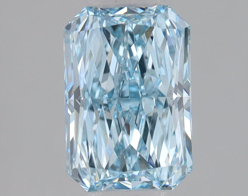 Radiant cut lab-grown diamond with light blue tint and faceted surface showing internal reflections.