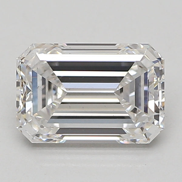 Emerald-cut lab-grown diamond with faceted surfaces and step-cut pattern, displaying clear coloration and reflection on neutr