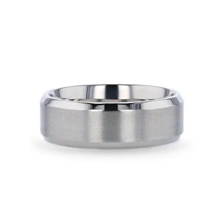 Lifestyle image promoting SHIRE titanium men’s wedding ring with brushed center and polished beveled edges