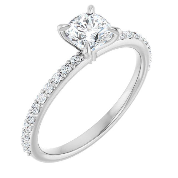 White gold engagement ring with cushion-cut center stone and diamond-accented band.