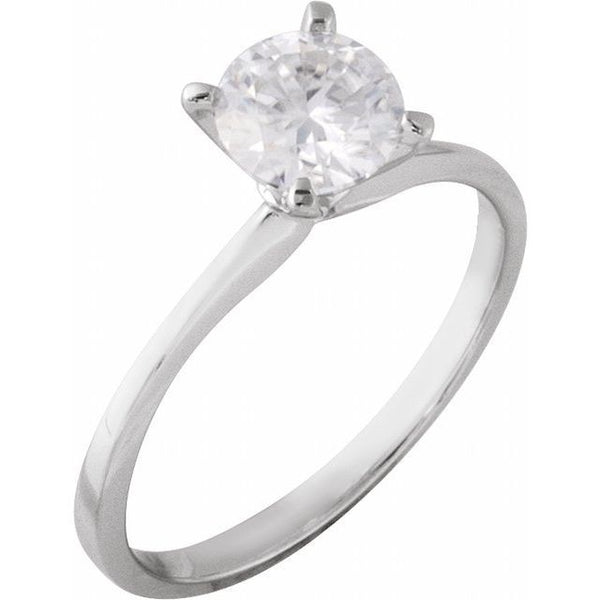 Silver solitaire engagement ring with round clear stone in four-prong setting.