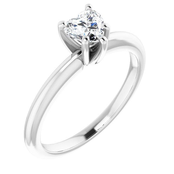 Silver solitaire engagement ring with heart-shaped diamond in four-prong setting on polished band.