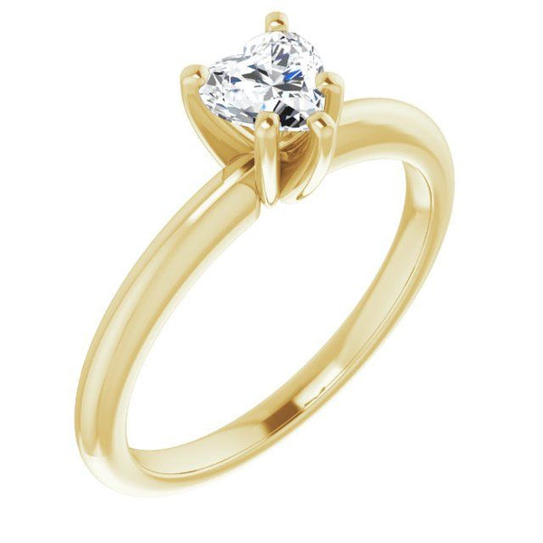 Yellow gold solitaire engagement ring with heart-shaped diamond in four-prong setting.