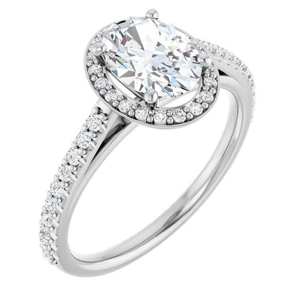 White gold engagement ring with oval-cut center stone surrounded by pavé halo and diamond-set band.