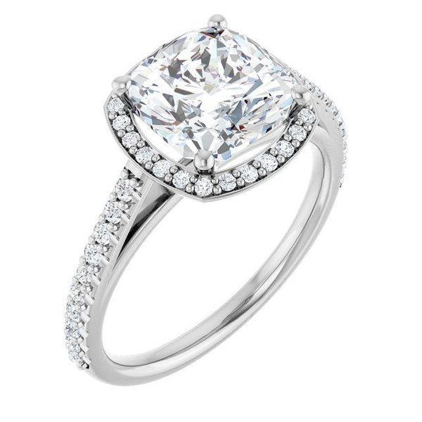 Silver engagement ring with large cushion-cut lab diamond in four-prong halo setting and pavé band.