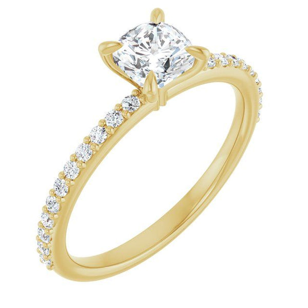 Yellow gold engagement ring with cushion-cut center stone and diamond-accented band.