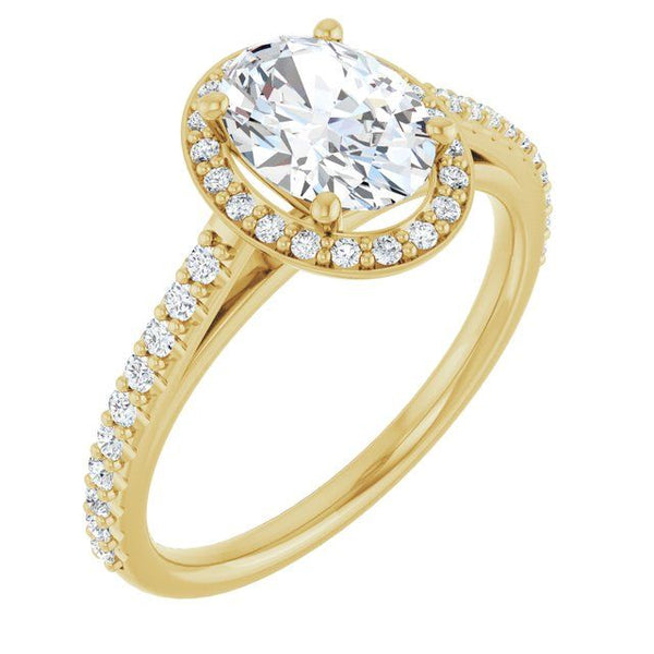 Gold engagement ring with oval center stone in four-prong setting surrounded by pavé halo and stone-set band.