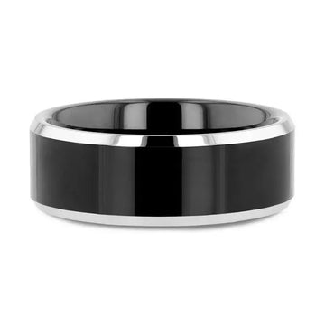 Flat lay of the black center tungsten ring with polished gray beveled edges