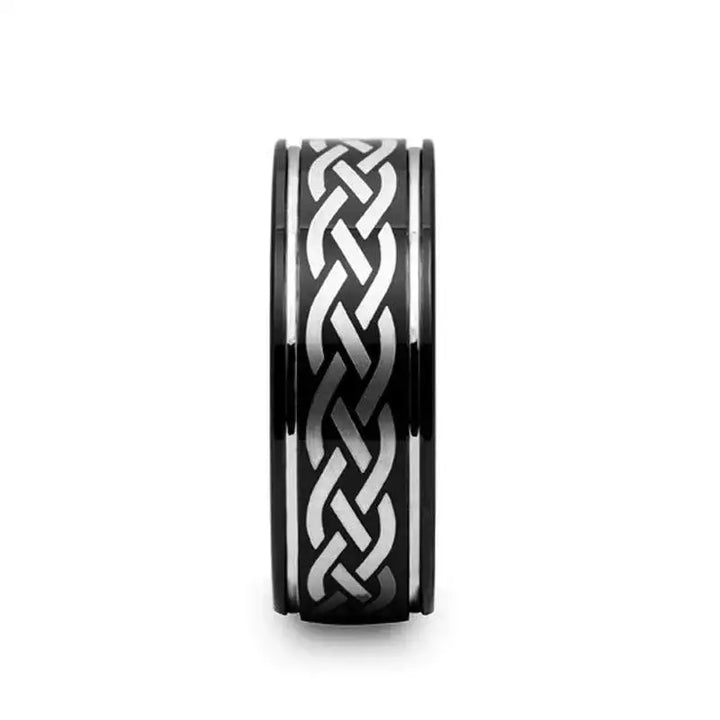 Front profile of the KILDARE 8mm black tungsten ring showing the centered Celtic knot engraving and dual offset grooves