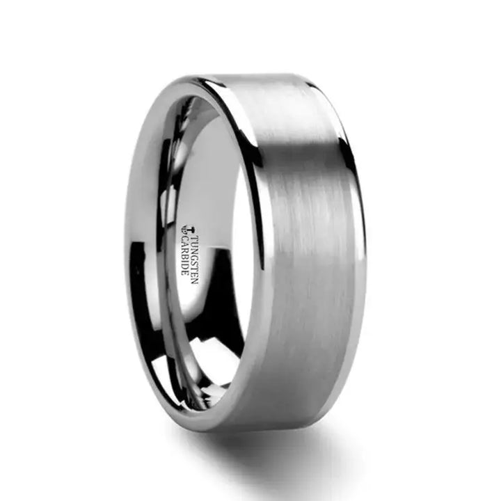 Wide flat tungsten carbide ring featuring brushed center and polished edges, angled view