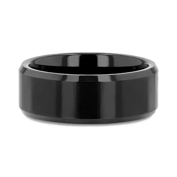 Top flat lay of the INFINITY black tungsten ring displaying the beveled edges and smooth surface