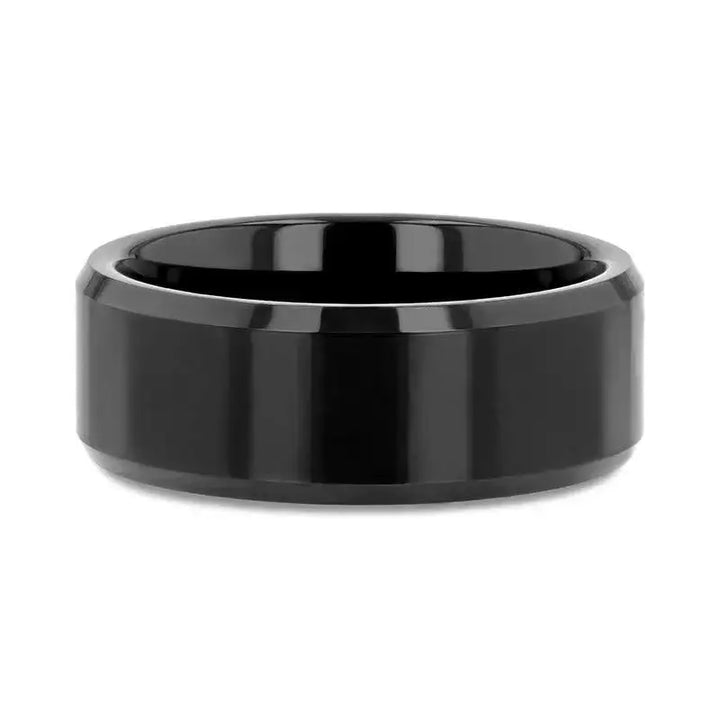 Top flat lay of the INFINITY black tungsten ring displaying the beveled edges and smooth surface