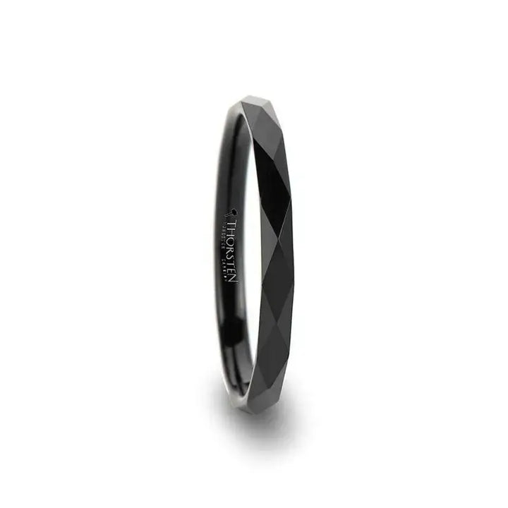 Side view of a 2mm women’s black tungsten carbide ring with diamond-faceted pattern and polished interior