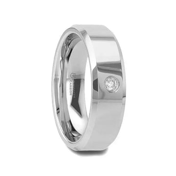 Lifestyle photo of a person wearing a beveled tungsten carbide wedding band with a bezel-set diamond