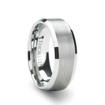 Lifestyle photo of a person wearing a brushed-center tungsten carbide band with polished beveled edges on their ring finger.