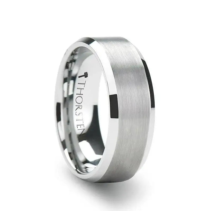 Lifestyle photo of a person wearing a brushed-center tungsten carbide band with polished beveled edges on their ring finger.