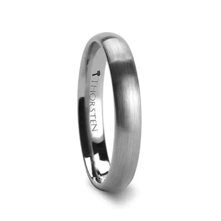 Side view of PETRA domed brushed finish tungsten ring showing slim 4mm band with polished interior and THORSTEN engraving