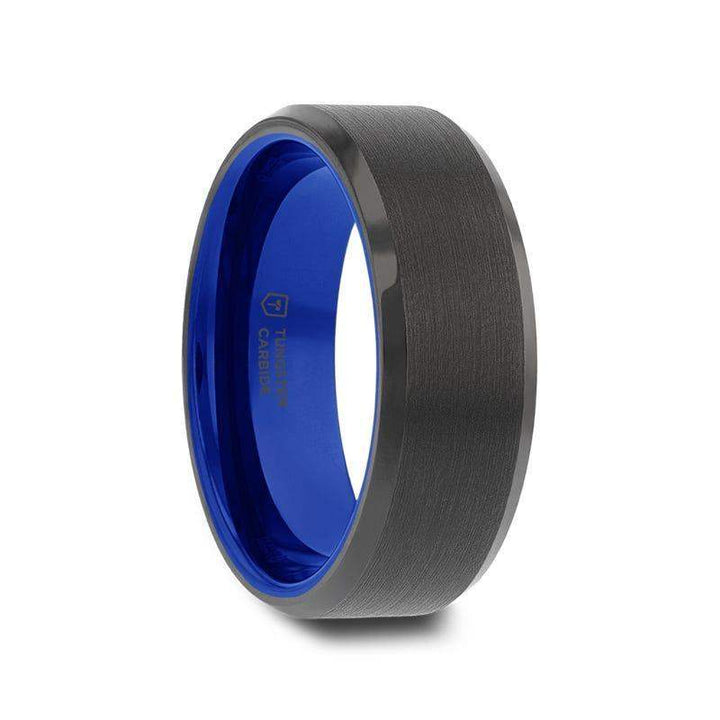 Side angle of a black brushed tungsten carbide ring with polished beveled edges and a vibrant cobalt-blue interior.