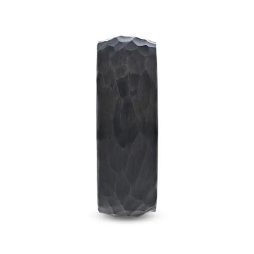 Front view of the RENEGADE hammered-finish black tungsten carbide ring highlighting the domed profile