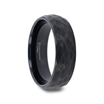 Side-angle product image of the RENEGADE domed hammered black tungsten carbide ring with polished interior