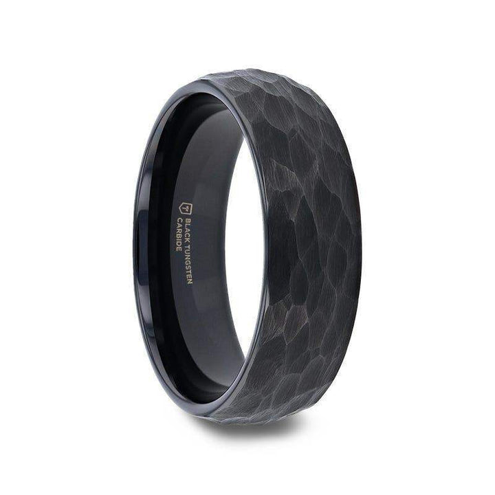 Side-angle product image of the RENEGADE domed hammered black tungsten carbide ring with polished interior