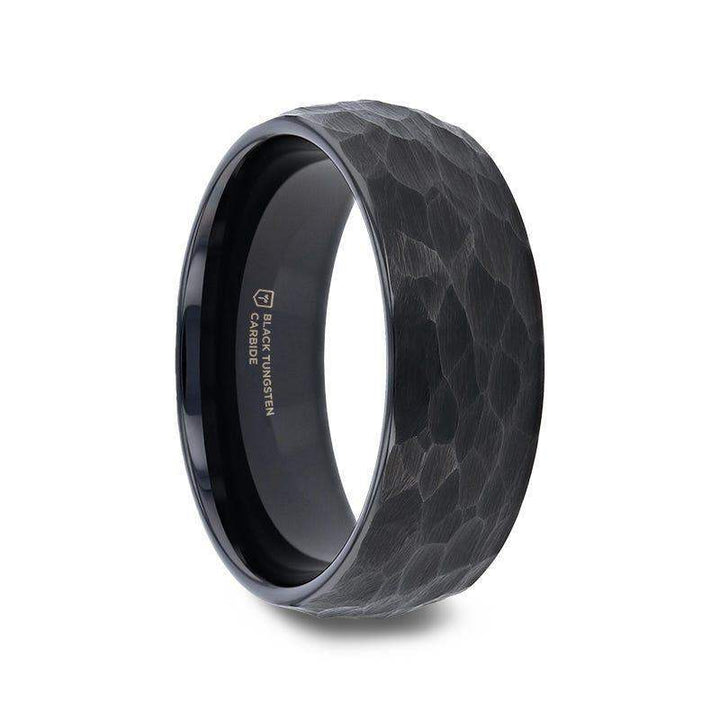 Angled view of the RENEGADE domed hammered black tungsten carbide wedding band showing the textured brushed exterior and polished black interior
