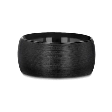Flat lay of the 12mm domed black tungsten carbide ring highlighting the brushed texture