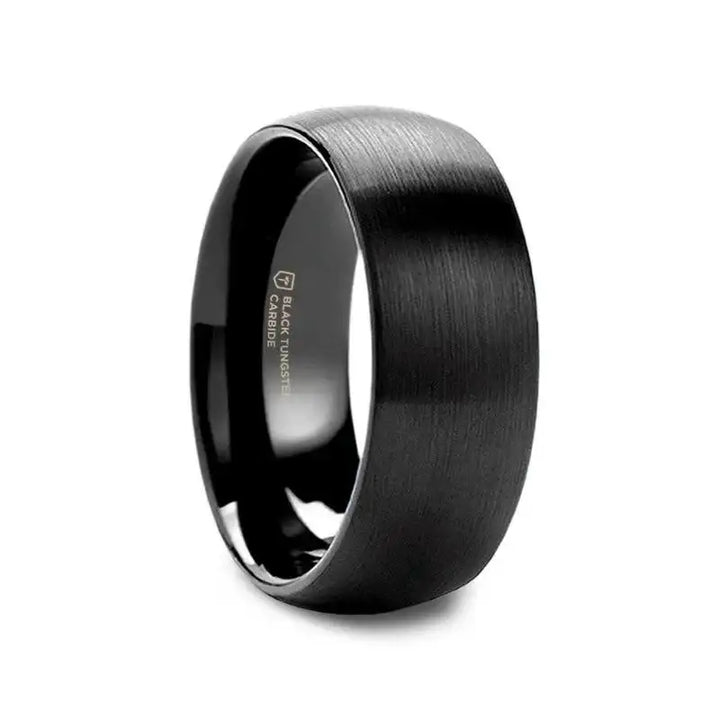 Angled view of a domed, brushed black tungsten carbide wedding band with polished interior