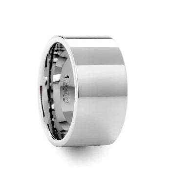 Angled view of a wide flat white tungsten carbide wedding band with high-polish finish
