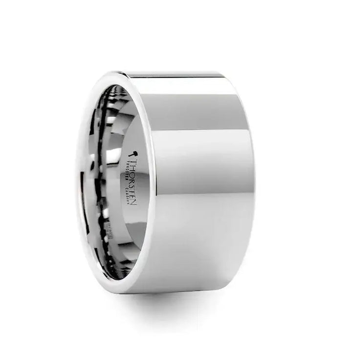 Angled view of a wide flat white tungsten carbide wedding band with high-polish finish