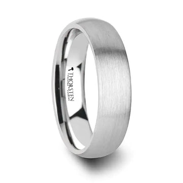 Angled view of the VIRGINIA 4mm domed brush-finished white tungsten ring with polished interior and Thorsten branding