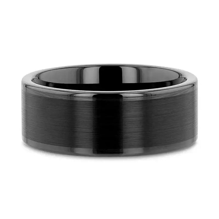 Top-down view of the black tungsten ring highlighting its flat profile and polished edges
