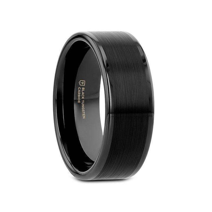 Angled view of a flat black tungsten carbide ring with brushed center and polished edges